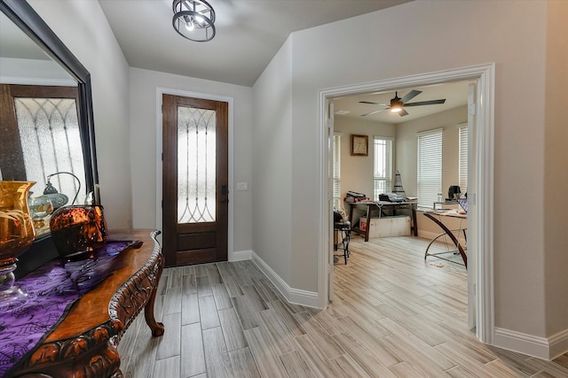 entrance foyer featuring ceiling fan and light hardwood / wood-style flooring