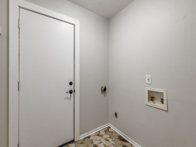 laundry room with washer hookup, electric dryer hookup, and a textured ceiling