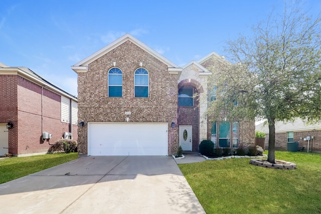 view of front of property with a front yard and a garage