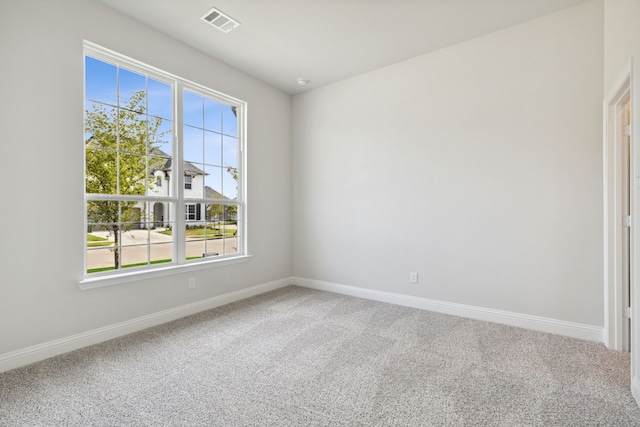 unfurnished room featuring carpet