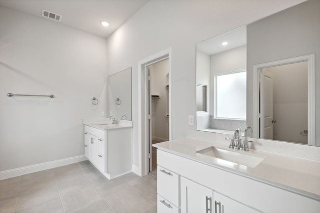 bathroom with vanity and tile patterned flooring