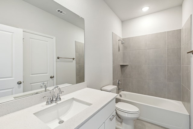 full bathroom featuring vanity, toilet, and tiled shower / bath combo