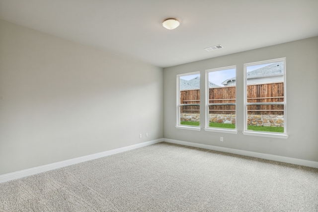 spare room featuring carpet floors