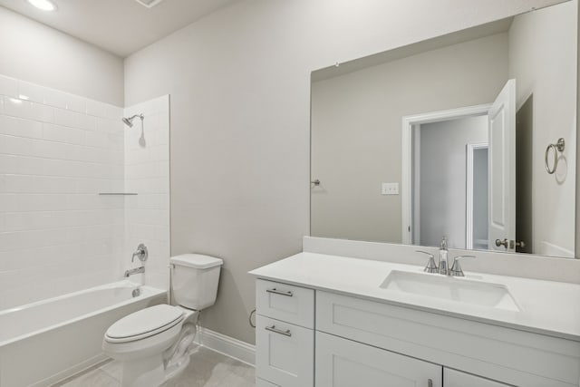 full bathroom featuring tiled shower / bath combo, vanity, and toilet