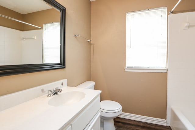 full bathroom with vanity, wood-type flooring, bathtub / shower combination, and toilet