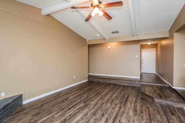 unfurnished living room with a textured ceiling, vaulted ceiling with beams, dark hardwood / wood-style flooring, and ceiling fan