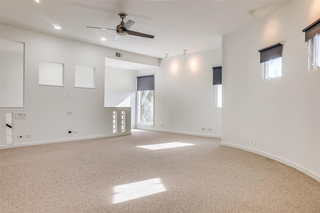 unfurnished room with ceiling fan and carpet floors