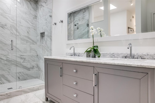 bathroom with vanity and a shower with shower door