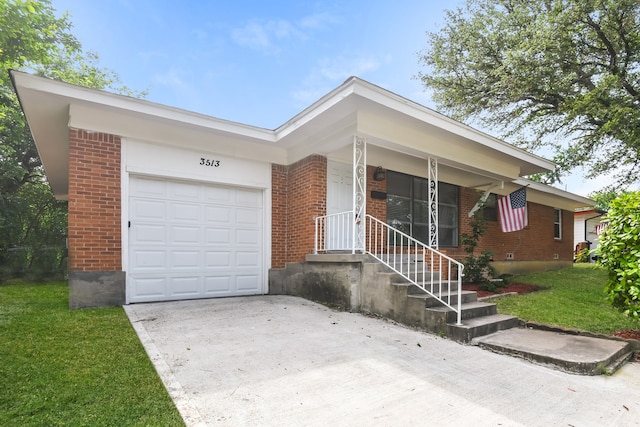 ranch-style home featuring a garage and a front yard