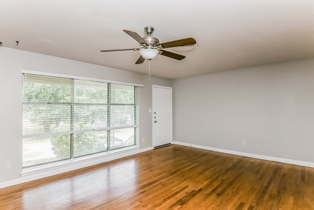 empty room featuring ceiling fan and wood-type flooring