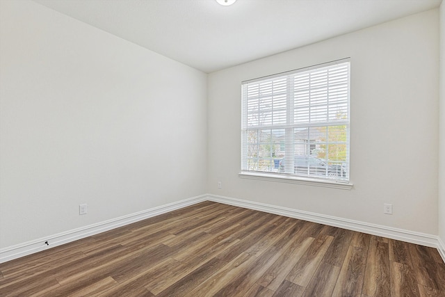 empty room featuring dark hardwood / wood-style floors