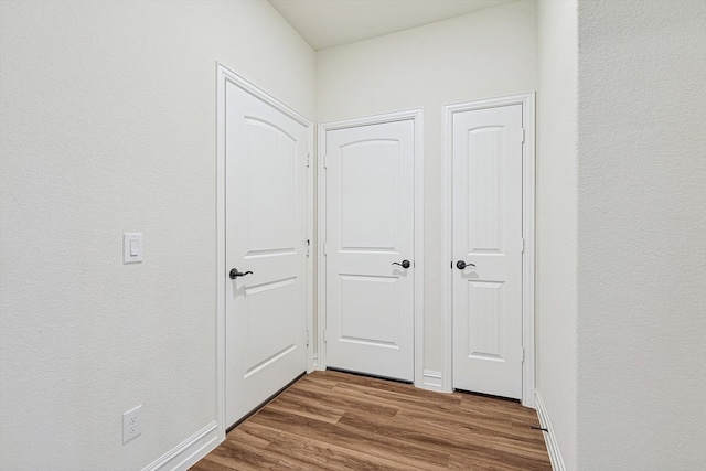 hallway featuring hardwood / wood-style floors