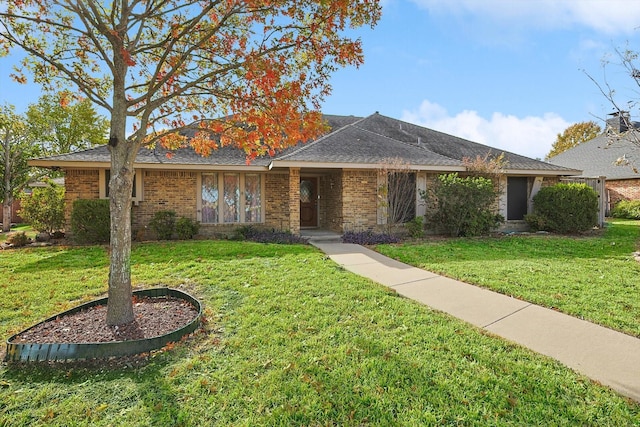 ranch-style home with a front lawn