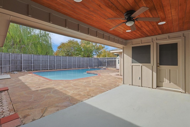 view of pool with a patio and ceiling fan