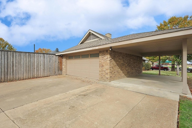 garage featuring a carport