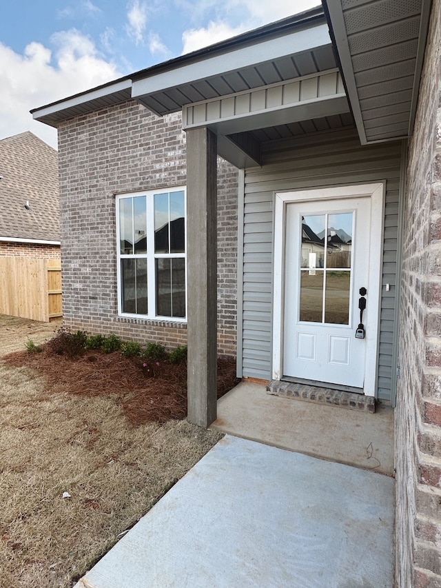 entrance to property with a patio