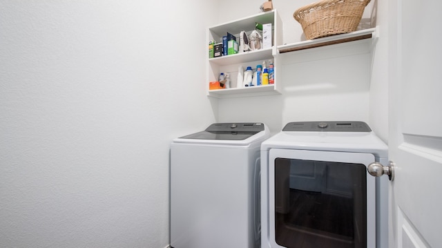 laundry room featuring washing machine and clothes dryer