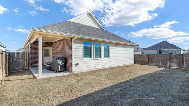 back of house with a patio