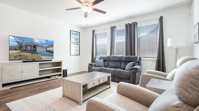 living room featuring hardwood / wood-style flooring and ceiling fan