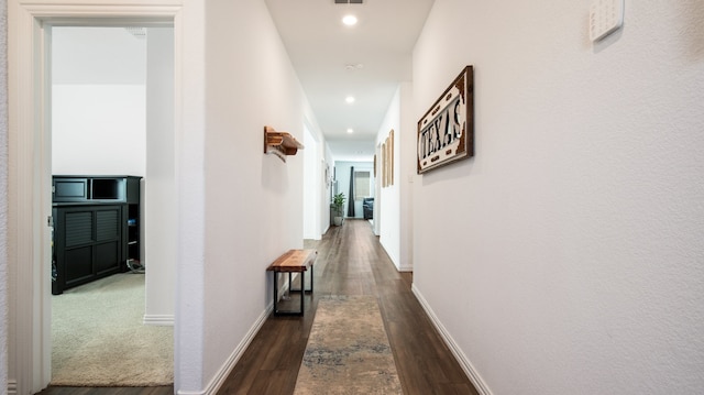 corridor featuring dark hardwood / wood-style flooring