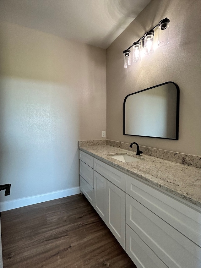 bathroom with vanity and hardwood / wood-style flooring