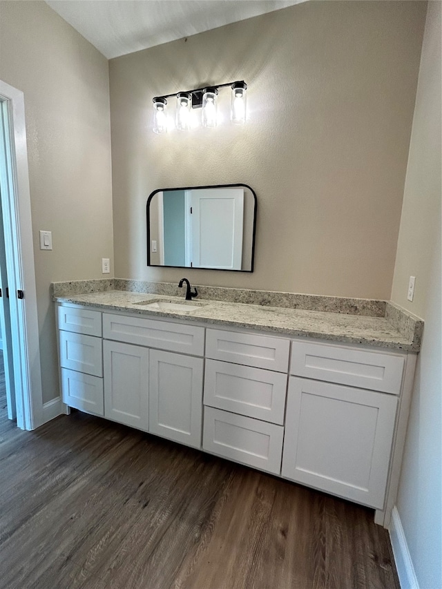 bathroom featuring hardwood / wood-style floors and vanity