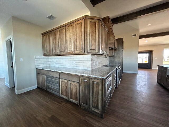 kitchen featuring beam ceiling, light stone countertops, stainless steel oven, dark hardwood / wood-style floors, and decorative backsplash