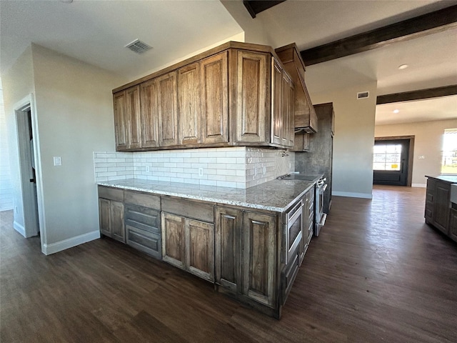 kitchen featuring vaulted ceiling with beams, backsplash, dark hardwood / wood-style flooring, wall oven, and light stone countertops