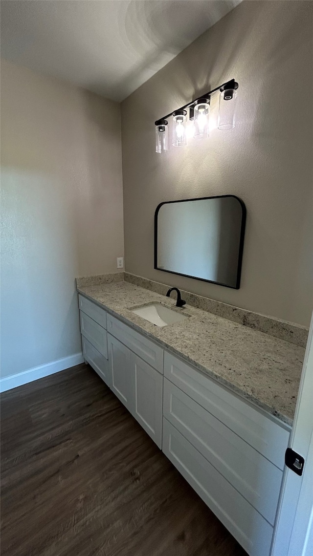 bathroom featuring vanity and hardwood / wood-style flooring