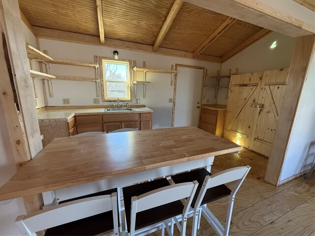 additional living space with ceiling fan, lofted ceiling, light wood-type flooring, and wooden ceiling