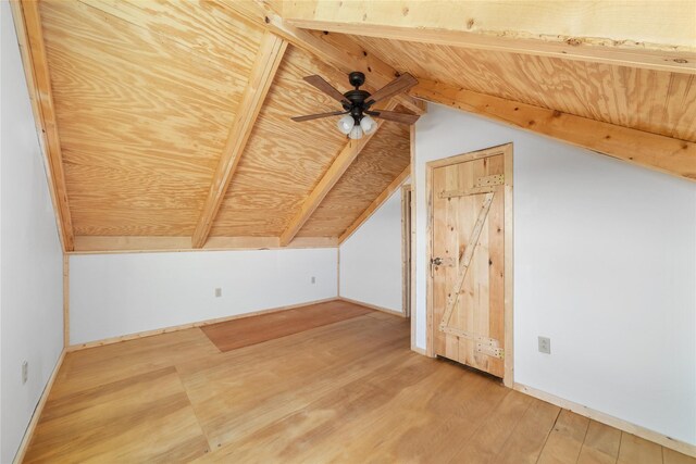 unfurnished room with beamed ceiling, ceiling fan, wood ceiling, and light hardwood / wood-style flooring