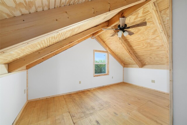 unfurnished room with wood ceiling, beam ceiling, light hardwood / wood-style floors, and a healthy amount of sunlight