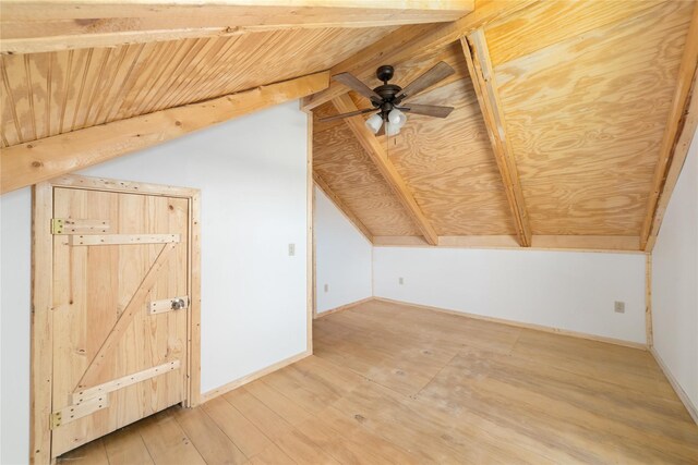 unfurnished room featuring hardwood / wood-style flooring, wooden ceiling, and vaulted ceiling with beams