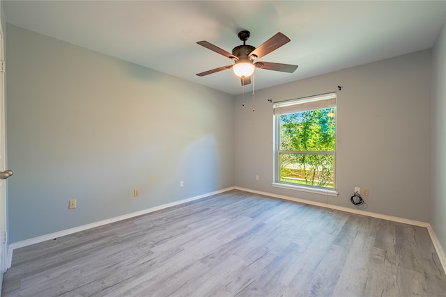 unfurnished room with ceiling fan and light hardwood / wood-style flooring