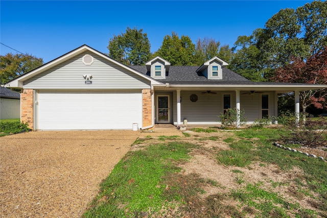 view of front of home with ceiling fan, covered porch, and a garage