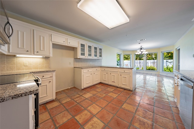 kitchen with backsplash, light stone counters, and stainless steel appliances