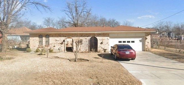 ranch-style home featuring a garage