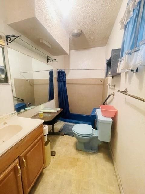 bathroom with walk in shower, toilet, wood-type flooring, a textured ceiling, and vanity