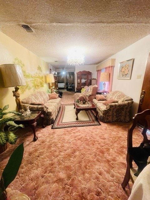 living room featuring carpet and a textured ceiling