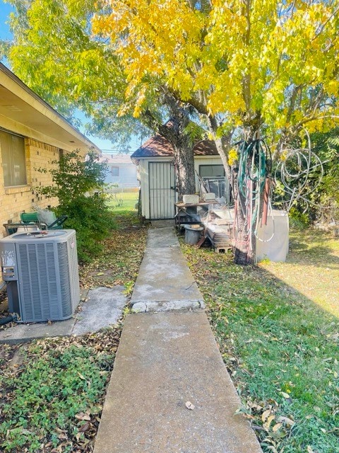 view of yard featuring central AC unit