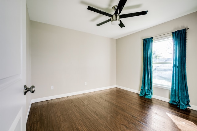 unfurnished room featuring dark hardwood / wood-style floors and ceiling fan