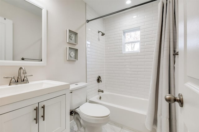 full bathroom featuring vanity, shower / bath combo, and toilet