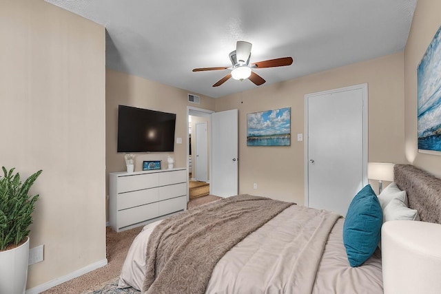 carpeted bedroom with ceiling fan