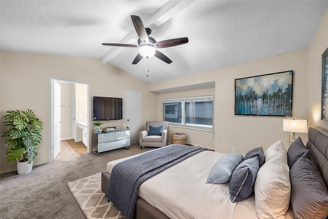 bedroom with light carpet, lofted ceiling with beams, ceiling fan, and ensuite bathroom