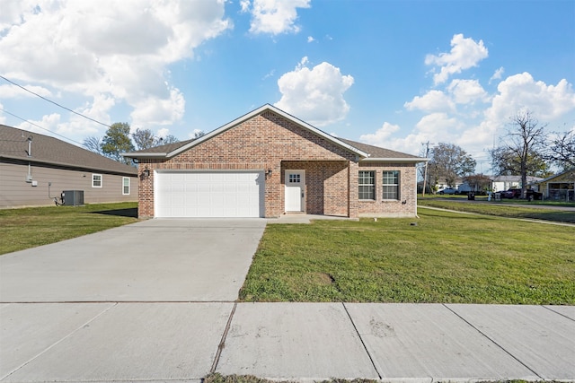 ranch-style home featuring a garage, cooling unit, and a front yard