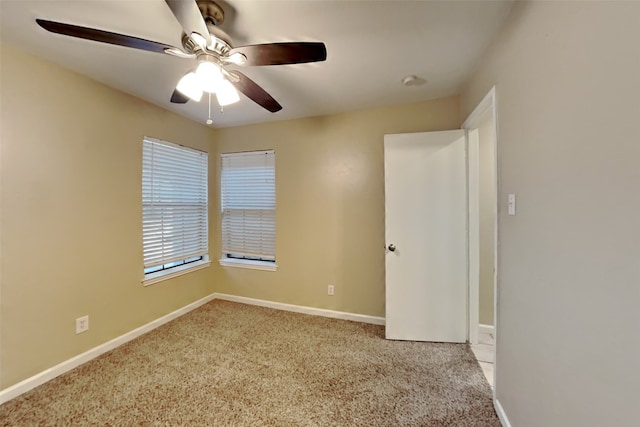 unfurnished room with light carpet and ceiling fan