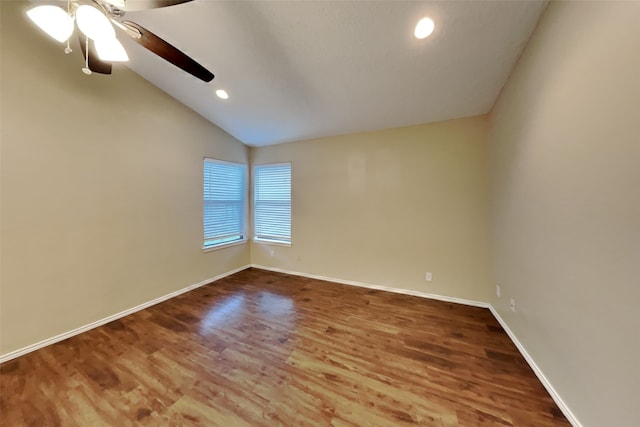 unfurnished room featuring hardwood / wood-style flooring, ceiling fan, and lofted ceiling