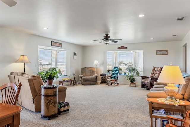 living room with carpet flooring and ceiling fan