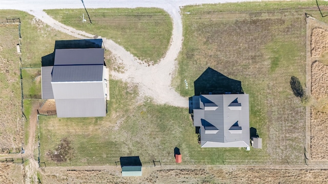 birds eye view of property with a rural view