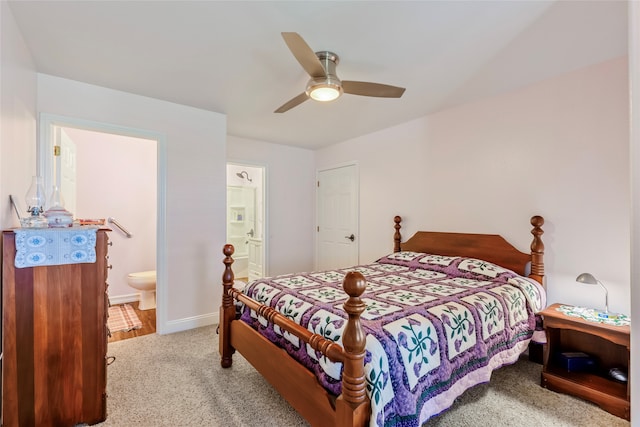 carpeted bedroom featuring ensuite bathroom and ceiling fan